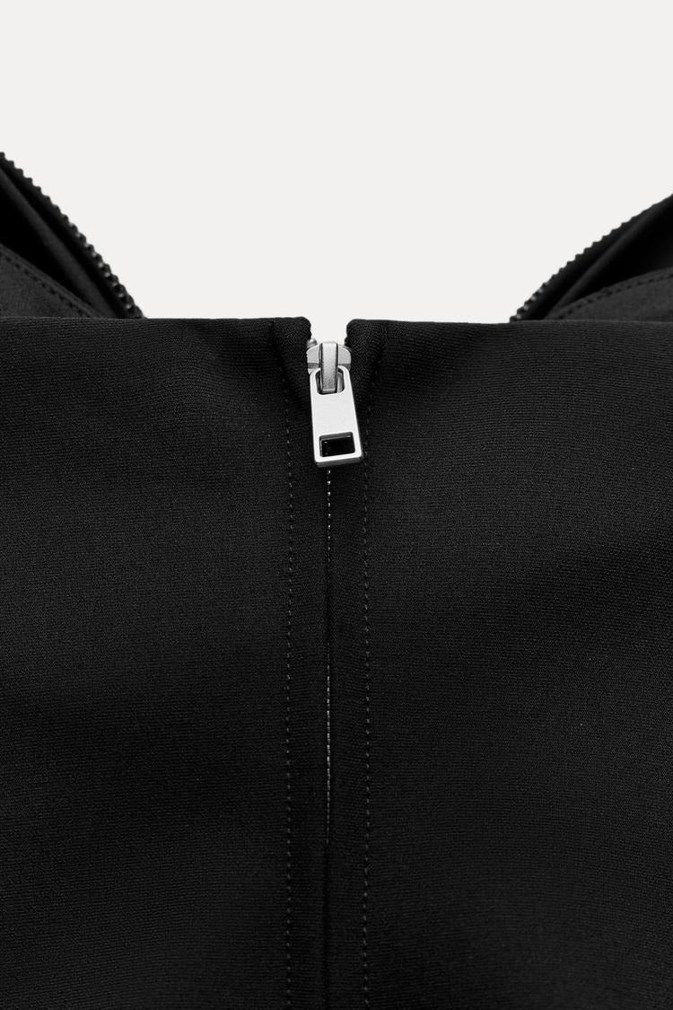 Top corto da donna — Dettaglio con fiocco e design scintillante