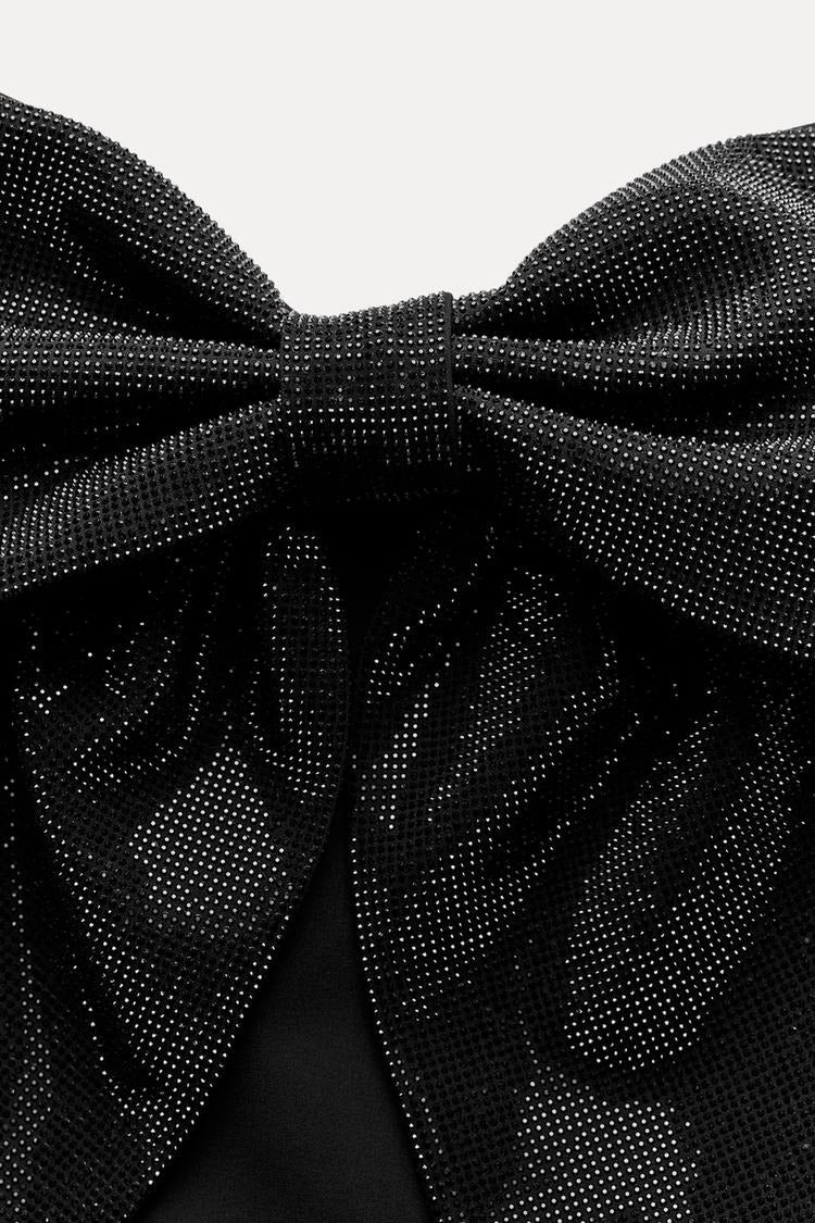 Top corto da donna — Dettaglio con fiocco e design scintillante